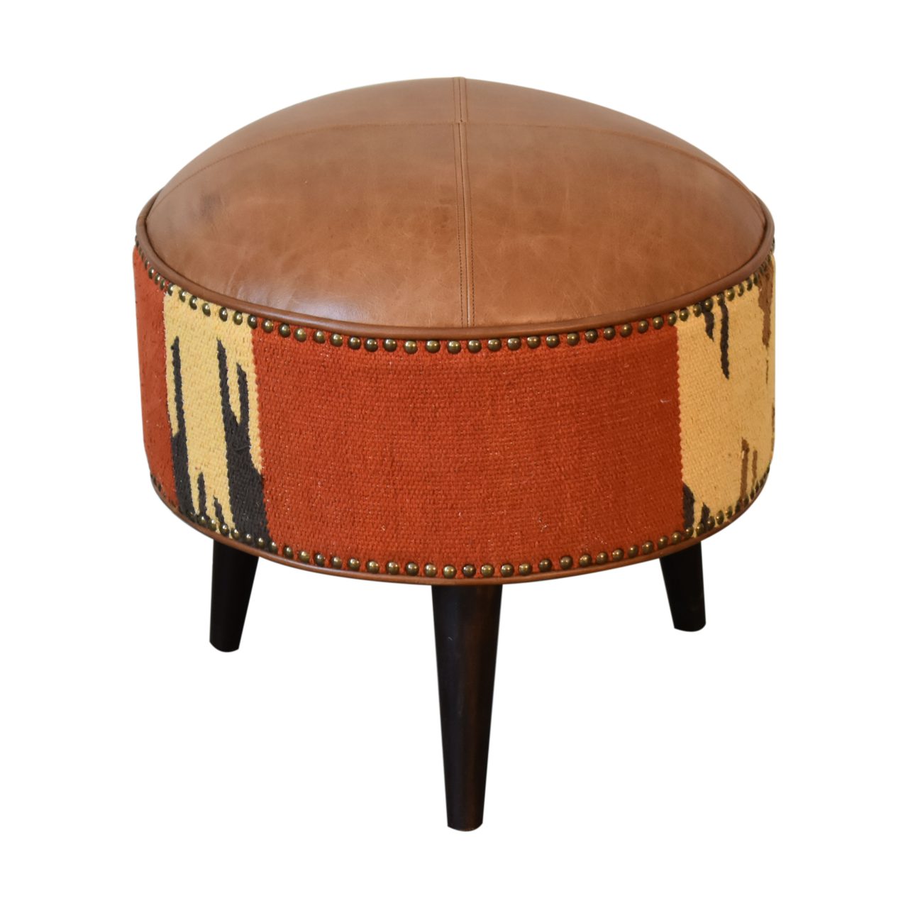 Durrie & Leather Mixed Footstool with Nordic-style legs, buffalo leather, and durrie print. Full  view