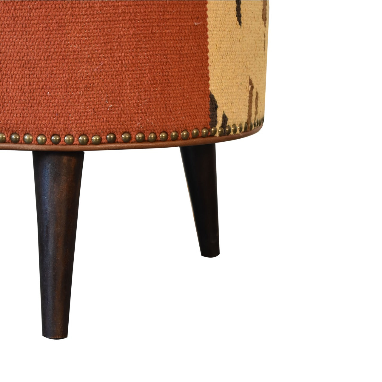 Durrie & Leather Mixed Footstool with Nordic-style legs, buffalo leather, and durrie print. Leg view