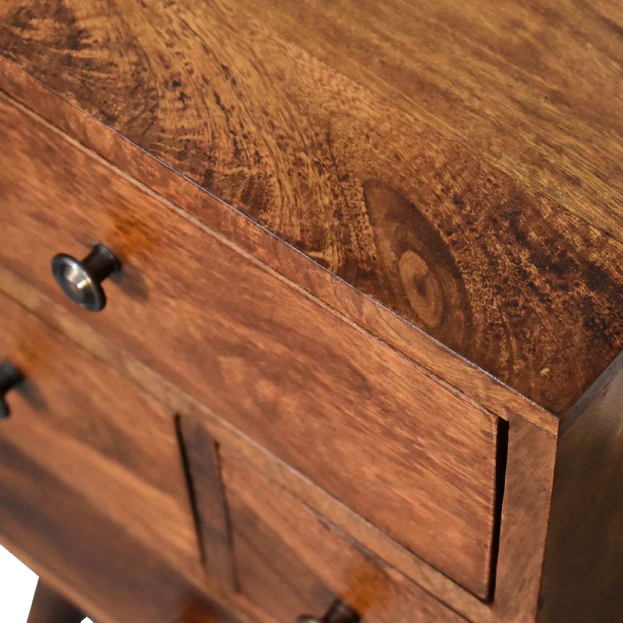4 Drawer Chestnut Nightstand made from solid mango wood with smooth finish, four drawers, and Nordic-style legs. Top edge view
