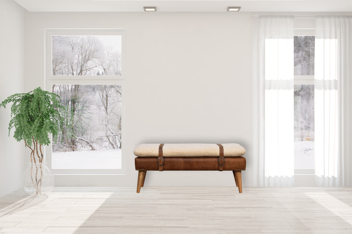 Modern boucle bench with white cushion and buffalo hide leather base – rustic accent seating for living room or entryway.