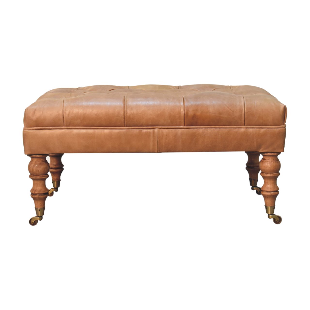 Tan buffalo leather ottoman with solid mango wood base, deep-buttoned top, and light walnut hand-turned feet.