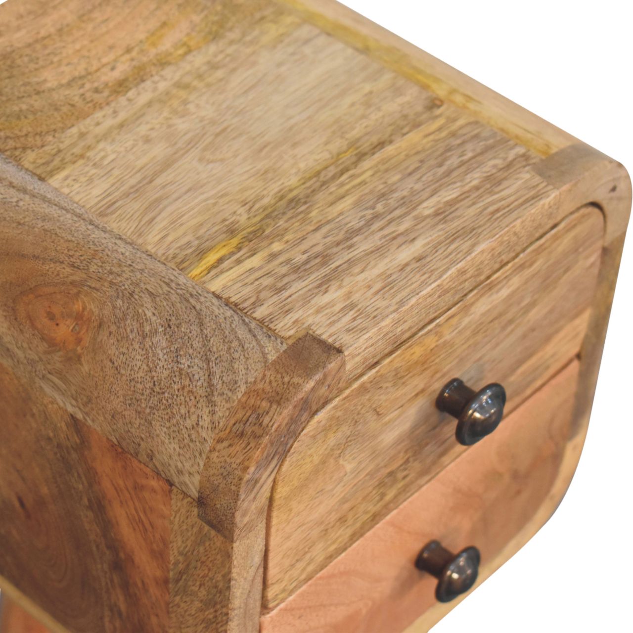 Extra Mini Curved Oak-ish Bedside Table made from solid mango wood with two drawers and Nordic-style legs. Top wood detailed view